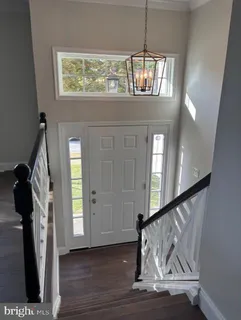 a view of entryway with wooden floor