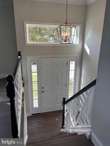 a view of entryway with wooden floor