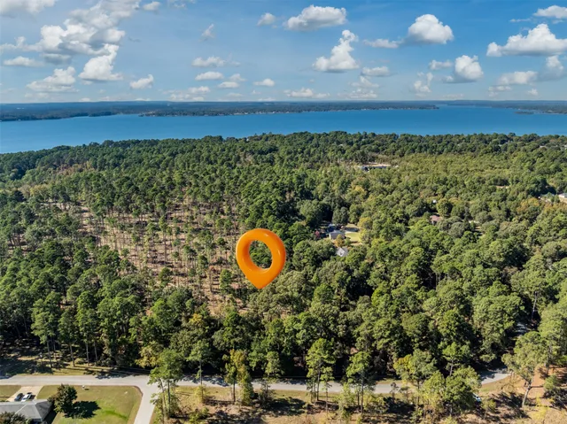 a view of a backyard with swimming pool