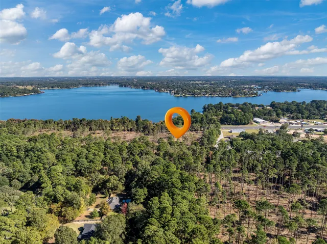 an aerial view of a house with a swimming pool