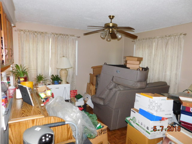 726 Terry Road Glendale Heights, IL 60139 - Photo 12 of 27 a living room with furniture and a flat screen tv