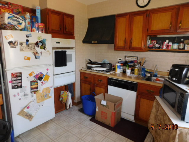 726 Terry Road Glendale Heights, IL 60139 - Photo 14 of 27 a kitchen with stainless steel appliances granite countertop a stove a sink and a refrigerator