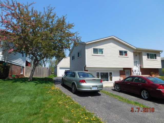 726 Terry Road Glendale Heights, IL 60139 - Photo 2 of 27 a car parked in front of a house