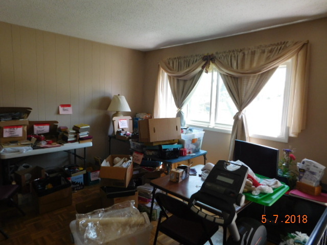 726 Terry Road Glendale Heights, IL 60139 - Photo 23 of 27 a living room with furniture a rug and a window