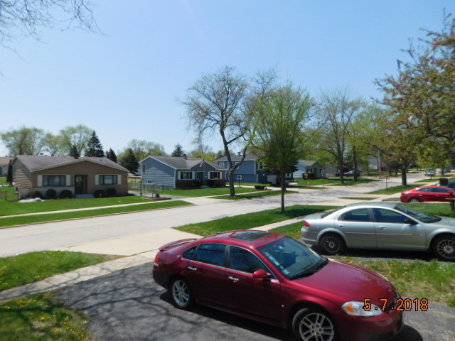 726 Terry Road Glendale Heights, IL 60139 - Photo 27 of 27 a view of a yard with cars parked