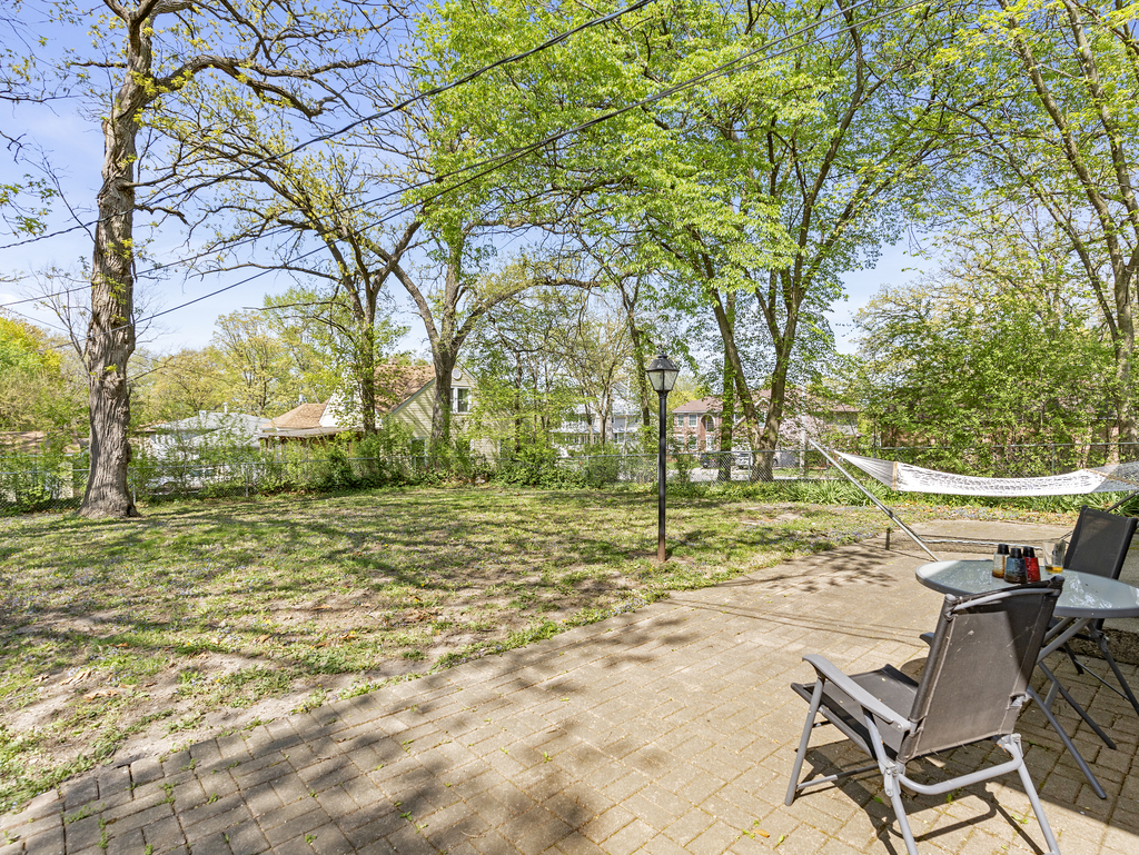 1604 Pine Road Homewood, IL 60430 - Photo 14 of 17 a view of a yard with a tree