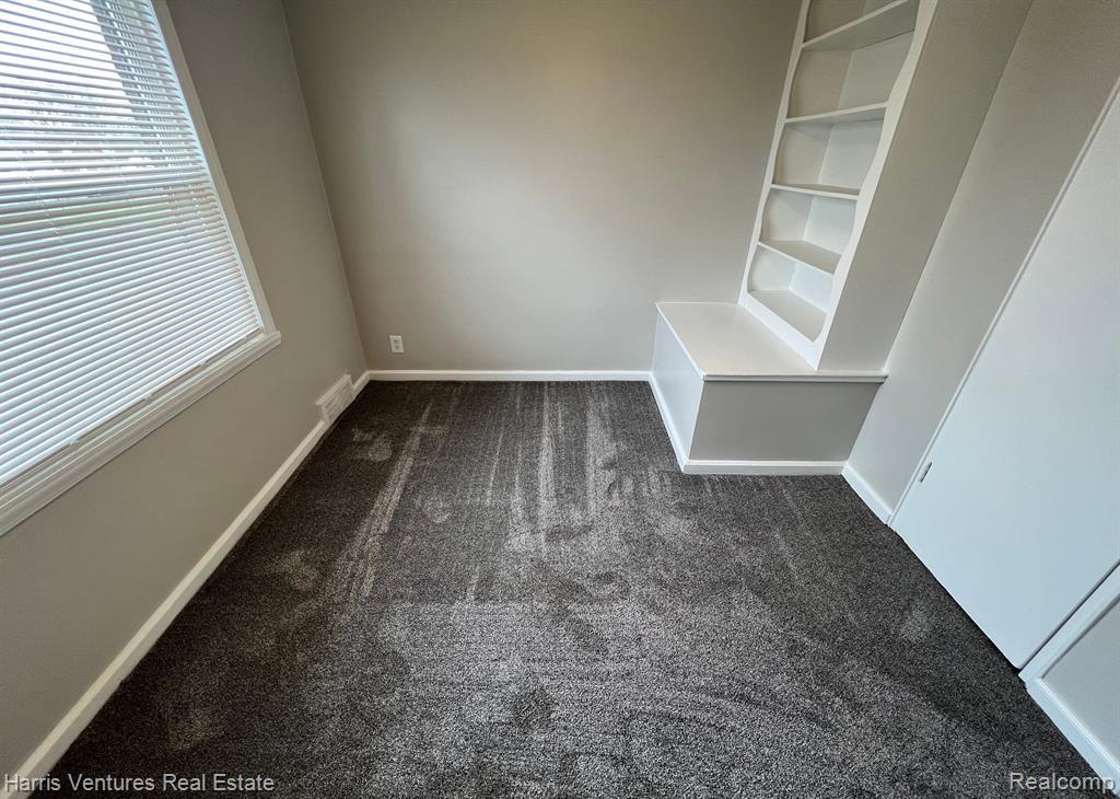 21534 Moross Road Grosse Pointe, MI 48236 - Photo 10 of 16 Bedroom #1 with carpeted flooring and light gray walls