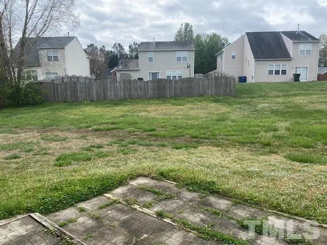 a view of a back yard of the house