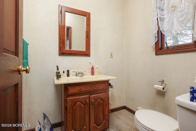 47-49 Appleton Avenue Leonardo, NJ 07737 - Photo 12 of 15 a bathroom with a toilet a sink and mirror