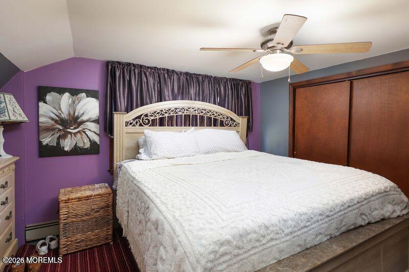 47-49 Appleton Avenue Leonardo, NJ 07737 - Photo 9 of 15 a bedroom with a bed and a chandelier