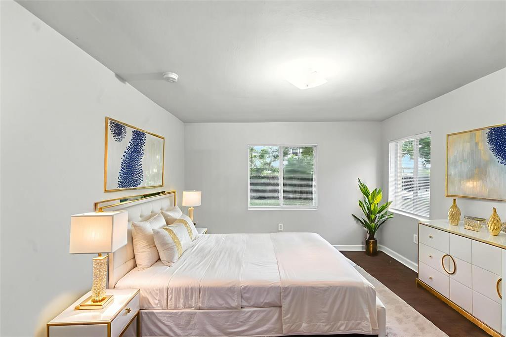 25355 Southwest 135th Court Homestead, FL 33032 - Photo 14 of 40 a bedroom with a bed and a window