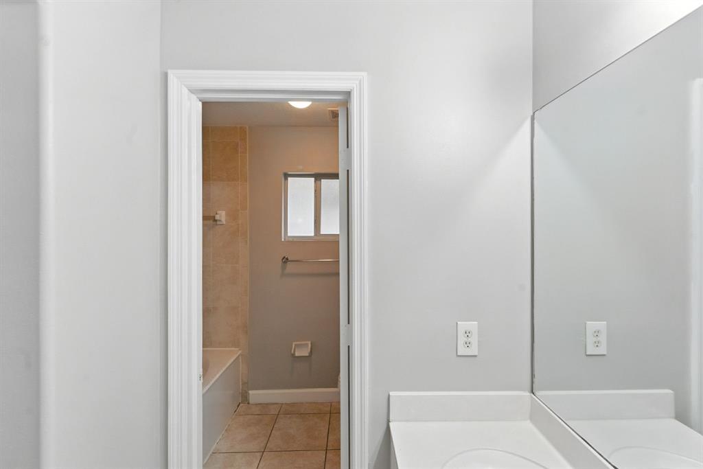 25355 Southwest 135th Court Homestead, FL 33032 - Photo 20 of 40 a bathroom with a tub and shower