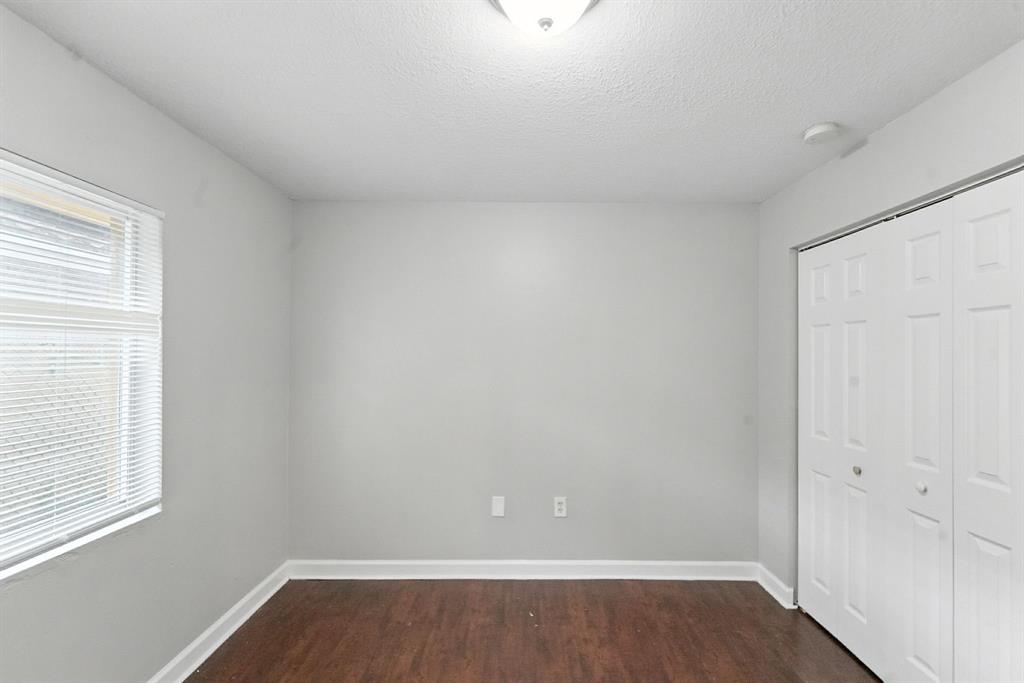 25355 Southwest 135th Court Homestead, FL 33032 - Photo 24 of 40 an empty room with wooden floor and windows