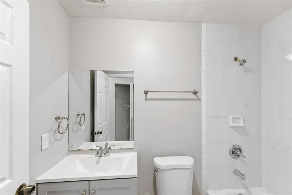 25355 Southwest 135th Court Homestead, FL 33032 - Photo 26 of 40 a bathroom with a sink toilet a mirror and shower