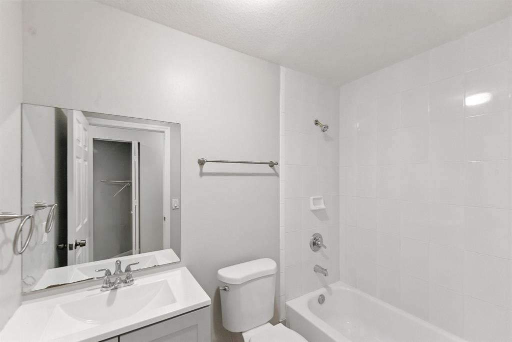 25355 Southwest 135th Court Homestead, FL 33032 - Photo 27 of 40 a bathroom with a bathtub shower sink mirror vanity and toilet