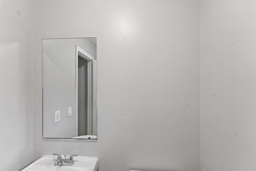 25355 Southwest 135th Court Homestead, FL 33032 - Photo 28 of 40 a bathroom with a sink and a mirror