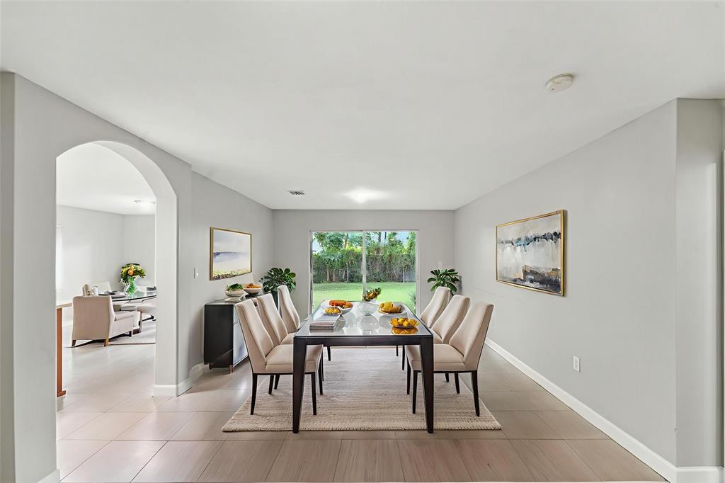 25355 Southwest 135th Court Homestead, FL 33032 - Photo 3 of 40 a view of a dining room with furniture window and outside view