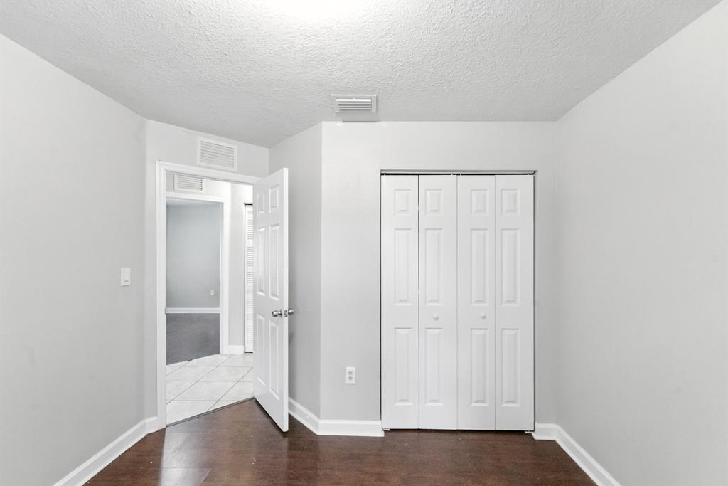 25355 Southwest 135th Court Homestead, FL 33032 - Photo 6 of 40 a view of an empty room with wooden floor