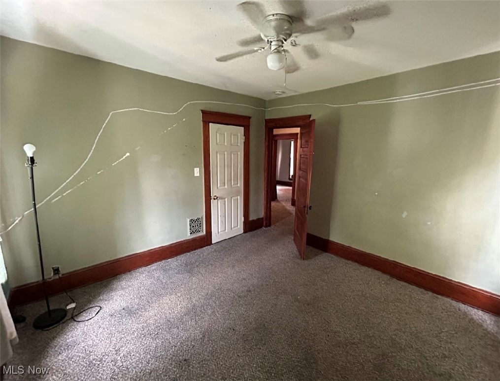 888 Stevenson Road Cleveland, OH 44110 - Photo 10 of 20 Spare room with carpet floors and ceiling fan