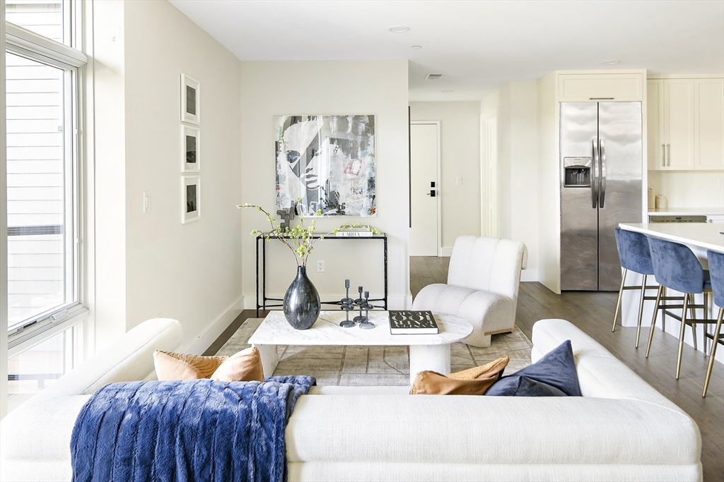 20 Kinmonth Road, Unit 301 Newton, MA 02468 - Photo 2 of 30 a living room with furniture and wooden floor