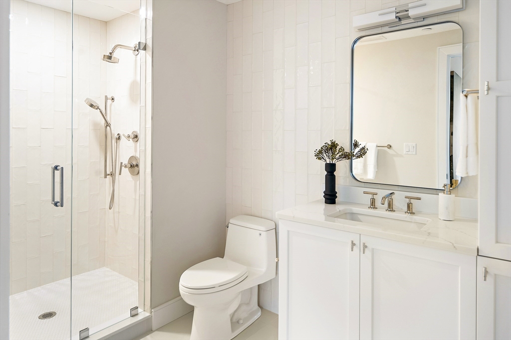 20 Kinmonth Road, Unit 301 Newton, MA 02468 - Photo 23 of 30 a bathroom with a granite countertop sink toilet and shower