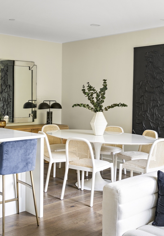 20 Kinmonth Road, Unit 301 Newton, MA 02468 - Photo 29 of 30 a view of a dining room with furniture and wooden floor