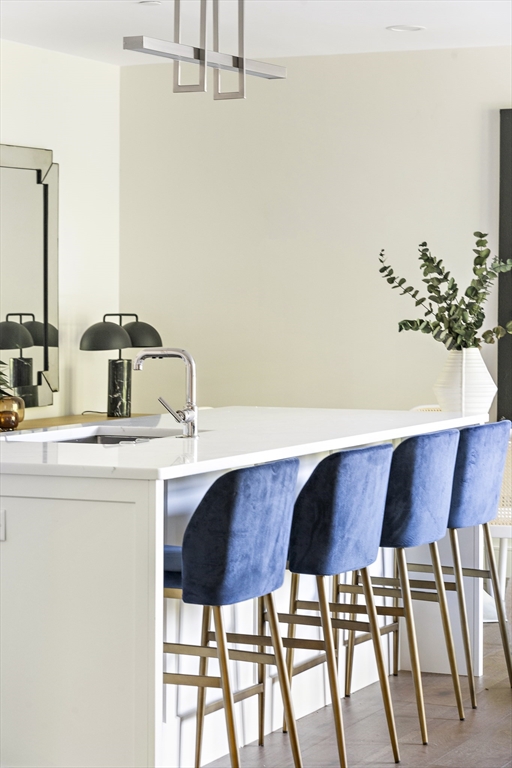 20 Kinmonth Road, Unit 301 Newton, MA 02468 - Photo 10 of 30 a kitchen with a table and chairs