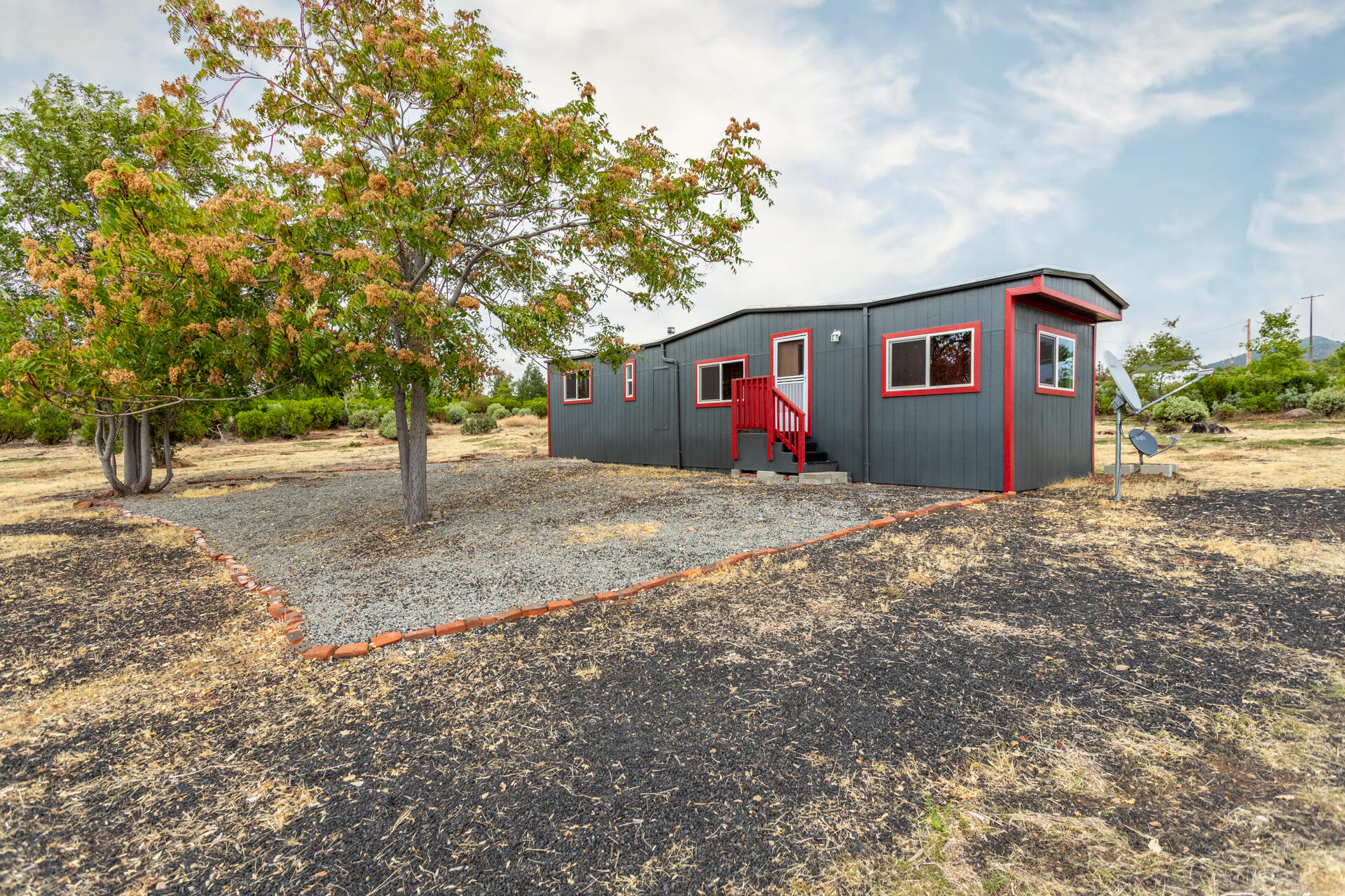 a front view of a house with a yard