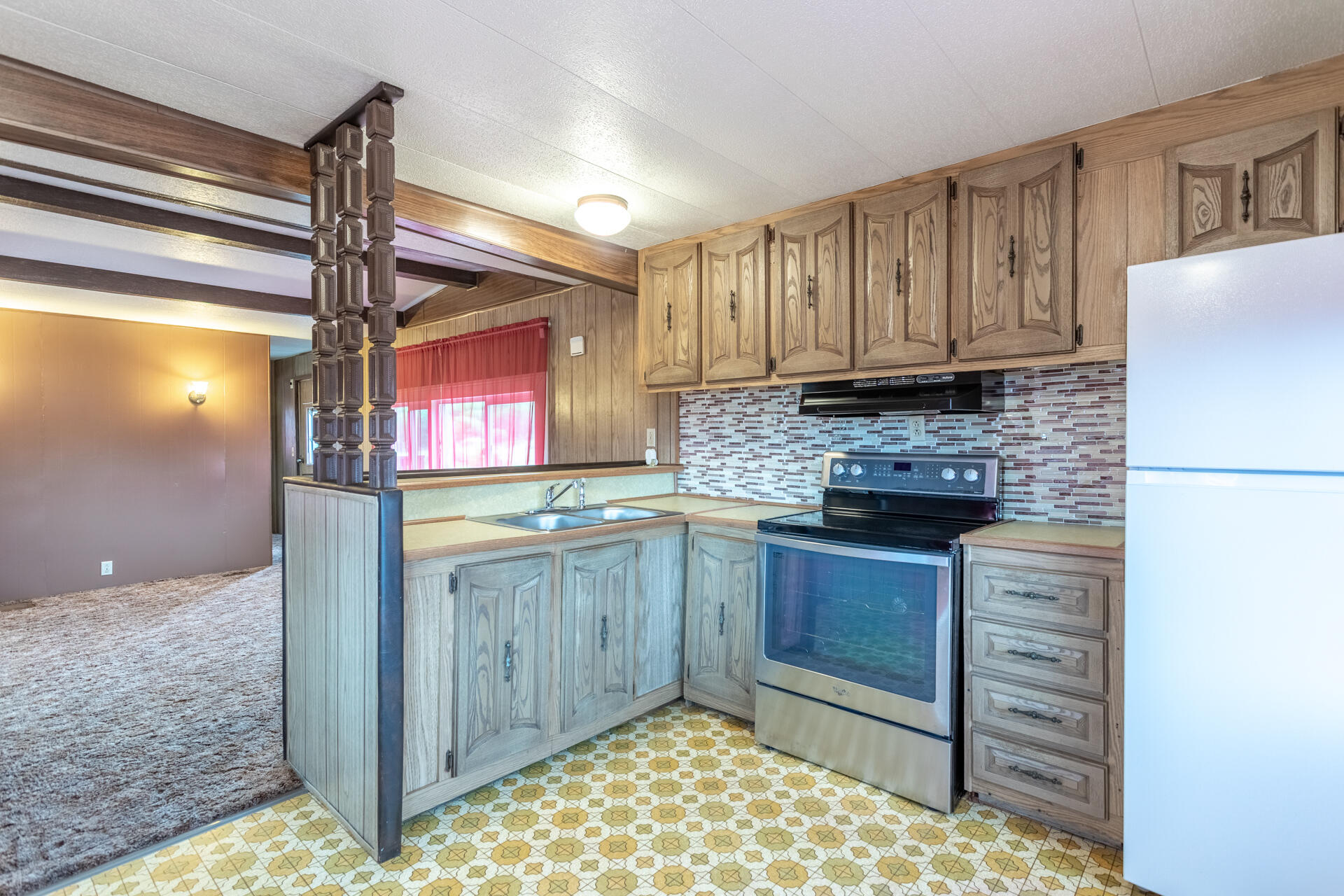 33150 Forward Road Manton, CA 96059 - Photo 6 of 12 a kitchen with kitchen island granite countertop a refrigerator a sink and dishwasher