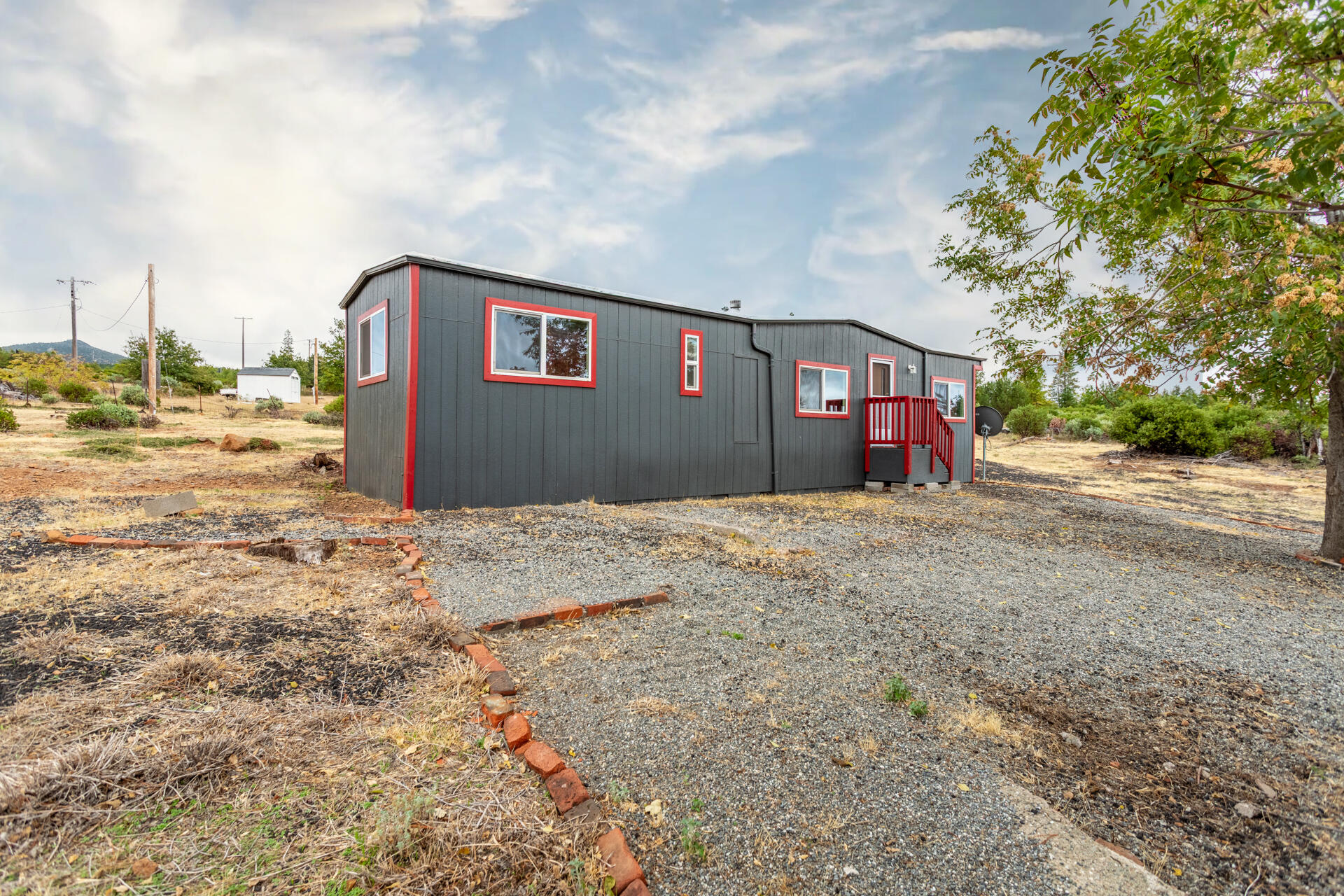 33150 Forward Road Manton, CA 96059 - Photo 10 of 12 a front view of a house with a yard