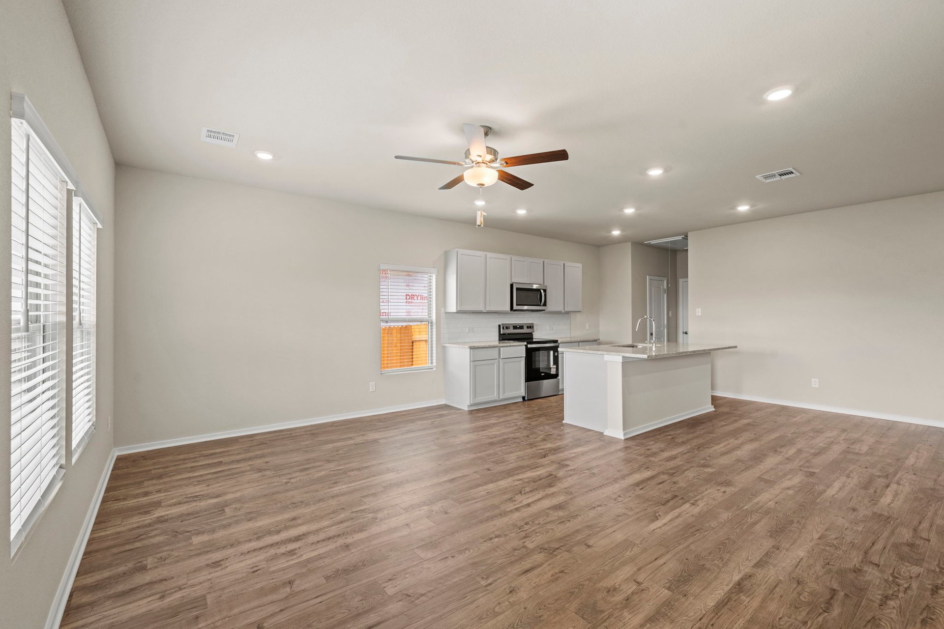 144 Wind Hill Jarrell, TX 76537 - Photo 16 of 26 From Family Room to Open Concept Kitchen