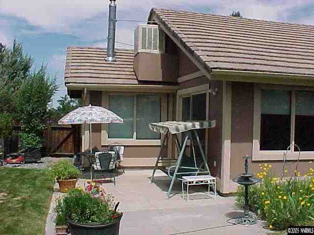 13180 Fellowship Way Reno, NV 89511 - Photo 6 of 9 a front view of a house with garden