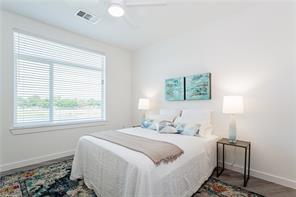 13130 Pond Springs Road, Unit 3214 Austin, TX 78729 - Photo 35 of 40 Natural light streams into this well-lit bedroom through a large window, offering a peaceful retreat.