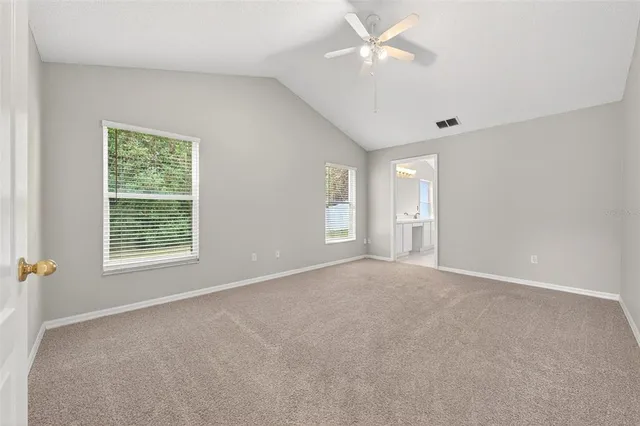 a view of an empty room with a window
