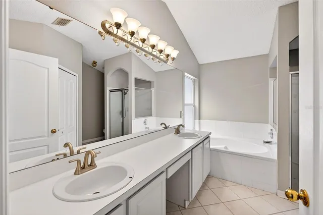 a bathroom with a sink double vanity and a mirror