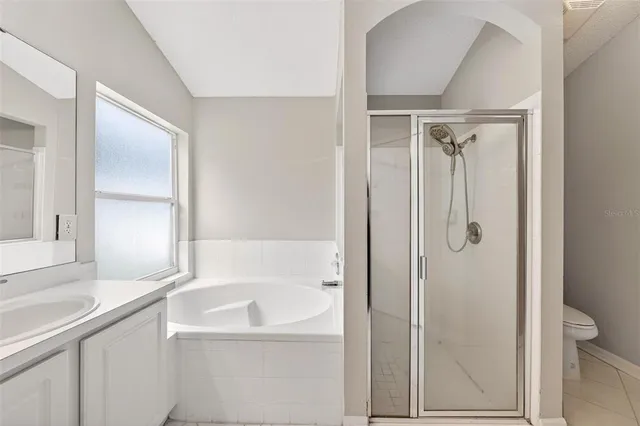 a view of a bathroom with a glass shower door