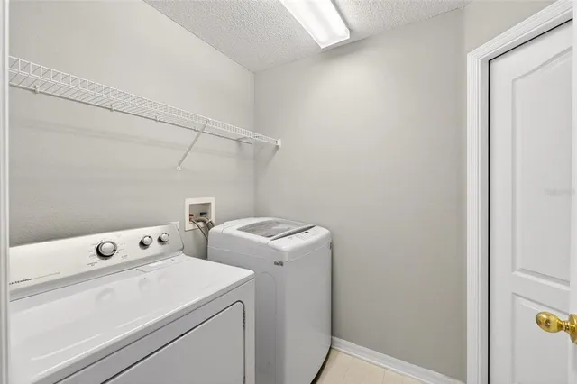 a view of a livingroom with furniture and staircase