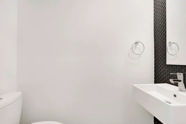 a view of a room with wooden floor and staircase