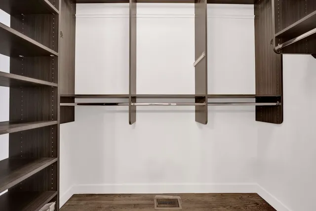 a view of a kitchen with wooden floor and a sink