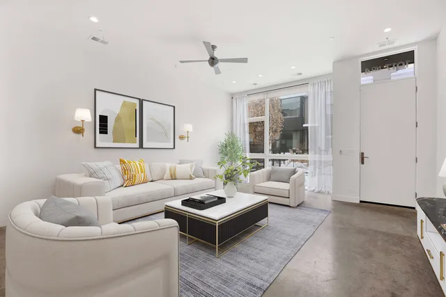 a kitchen with cabinets and chairs