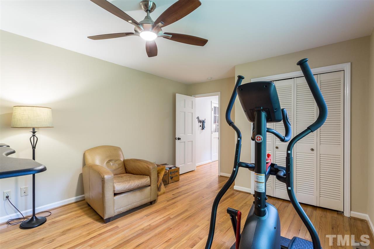 7809 Harps Mill Road Raleigh, NC 27615 - Photo 17 of 30 This versatile space with hardwood floors can be used as an exercise room, home office, playroom or bedroom.