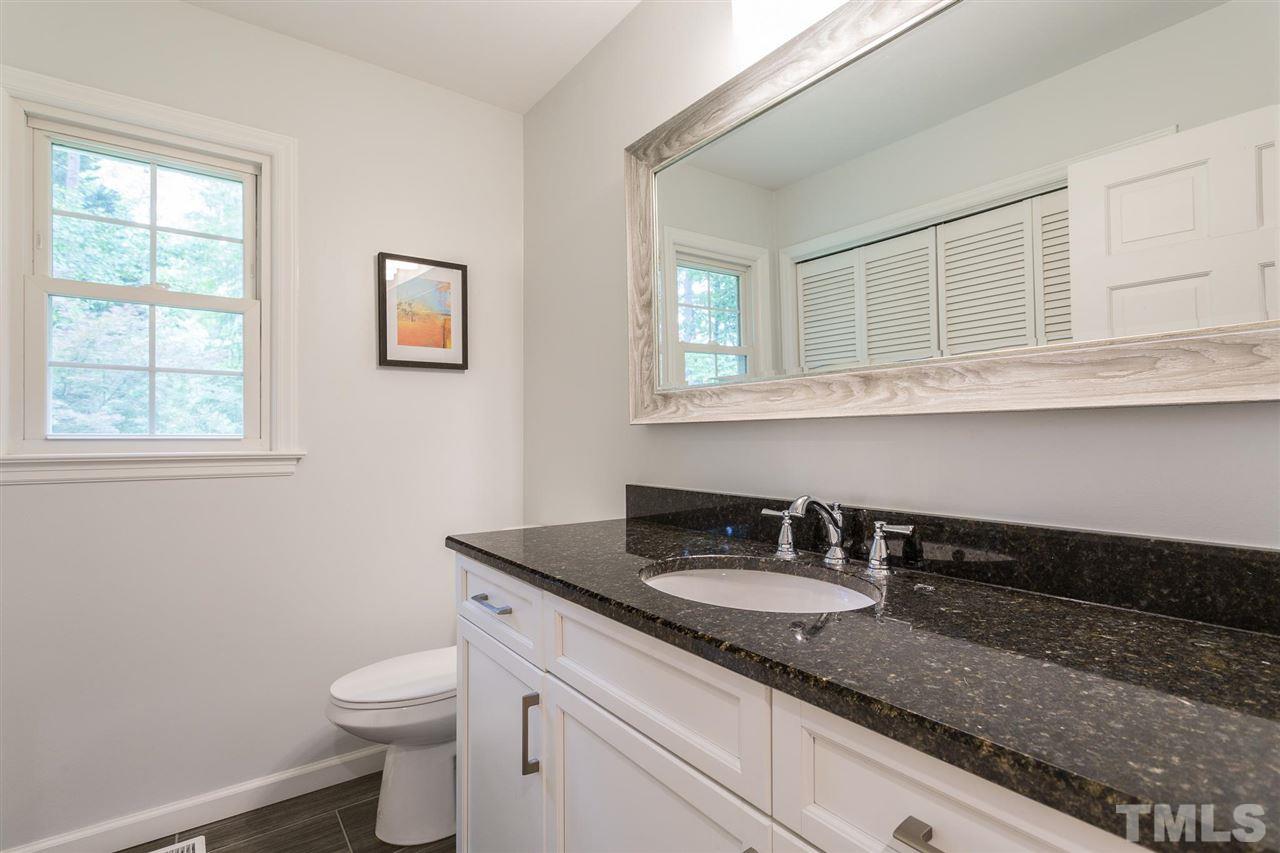 7809 Harps Mill Road Raleigh, NC 27615 - Photo 18 of 30 New cabinets, new greanite, new mirror, new floors, and new hardware.
