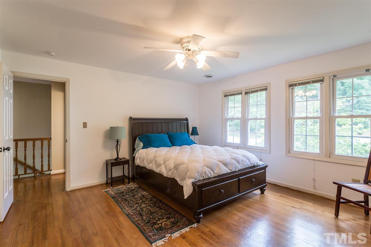 7809 Harps Mill Road Raleigh, NC 27615 - Photo 22 of 30 Bedroom #3 offers hardwood floors and ceiling fan.