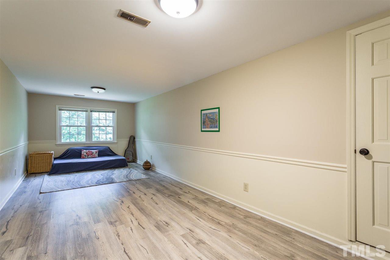 7809 Harps Mill Road Raleigh, NC 27615 - Photo 26 of 30 New updated flooring and access to 2 walk in attics.