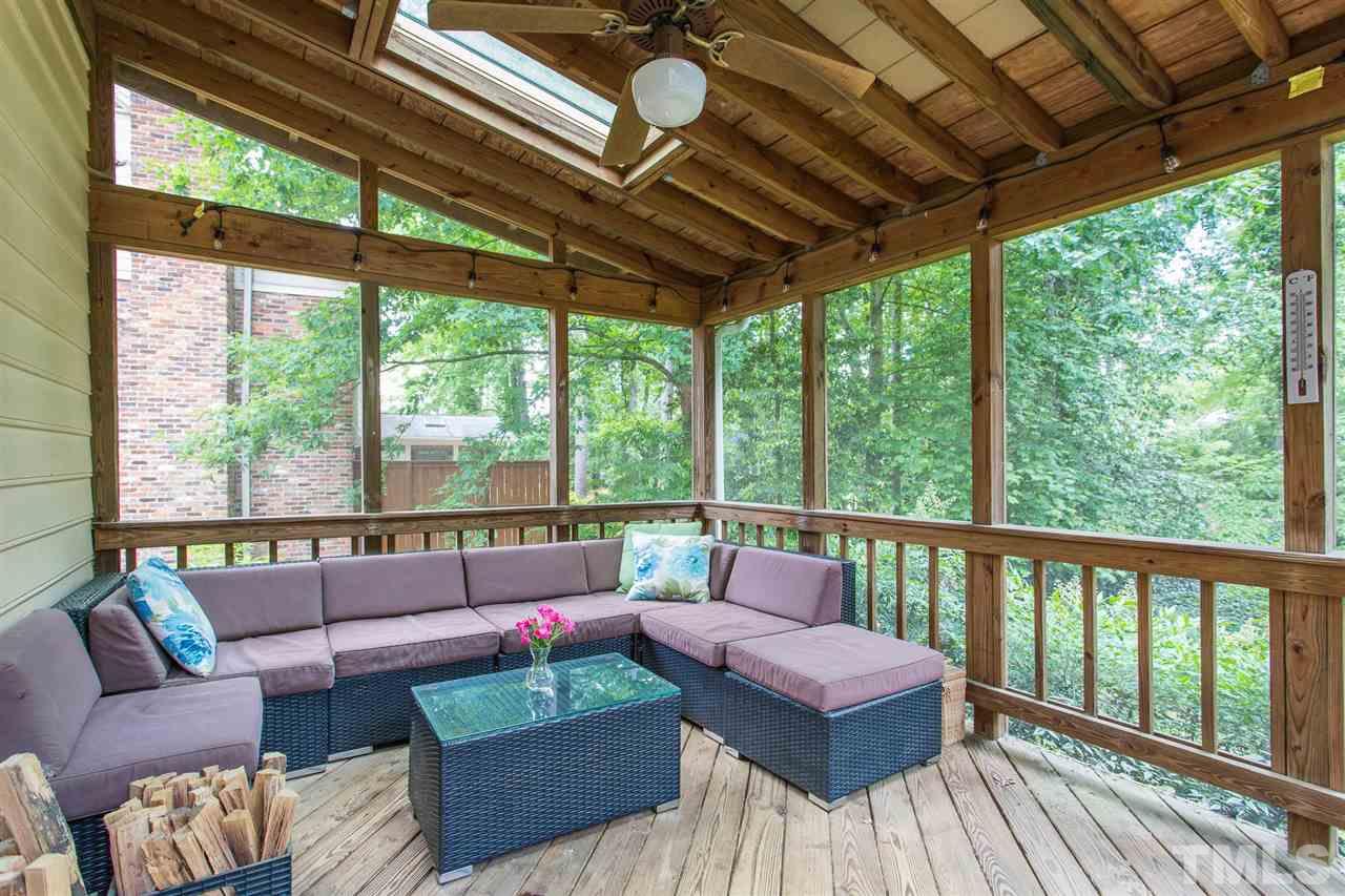 7809 Harps Mill Road Raleigh, NC 27615 - Photo 28 of 30 The screen porch is located off the family room and leads to the deck.