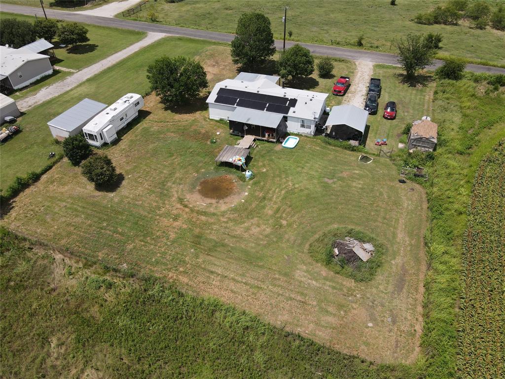 15962 Fritcher Road Pilot Point, TX 76258 - Photo 8 of 24 an aerial view of a house with garden space and street view
