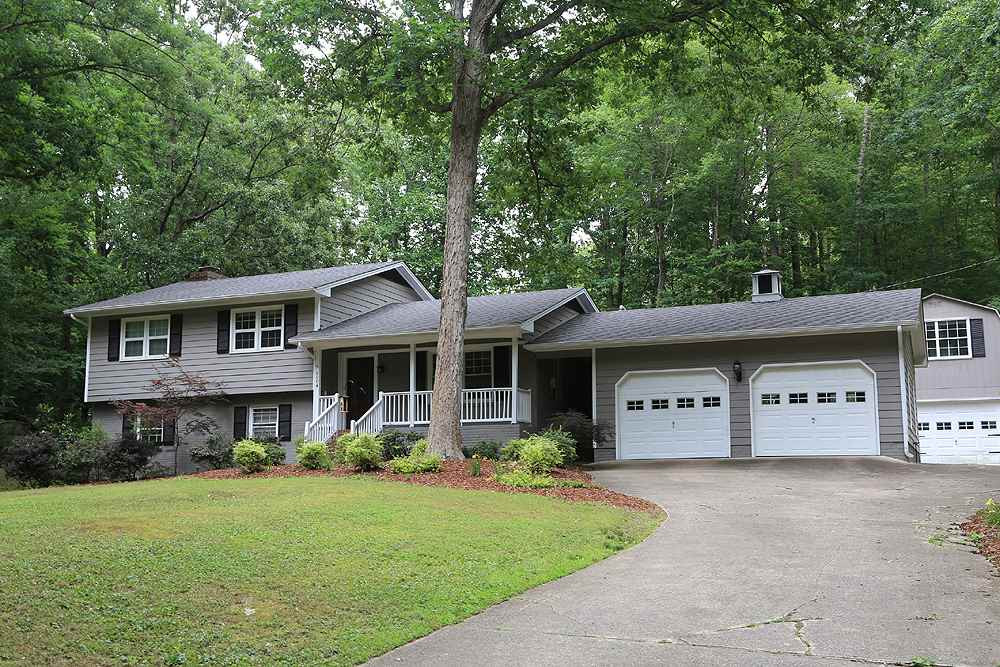 6004 Spring Valley Drive Raleigh, NC 27616 - Photo 1 of 25 What a serene setting, with 2 car garage attached to house and a separate one car with room above. Exterior Front