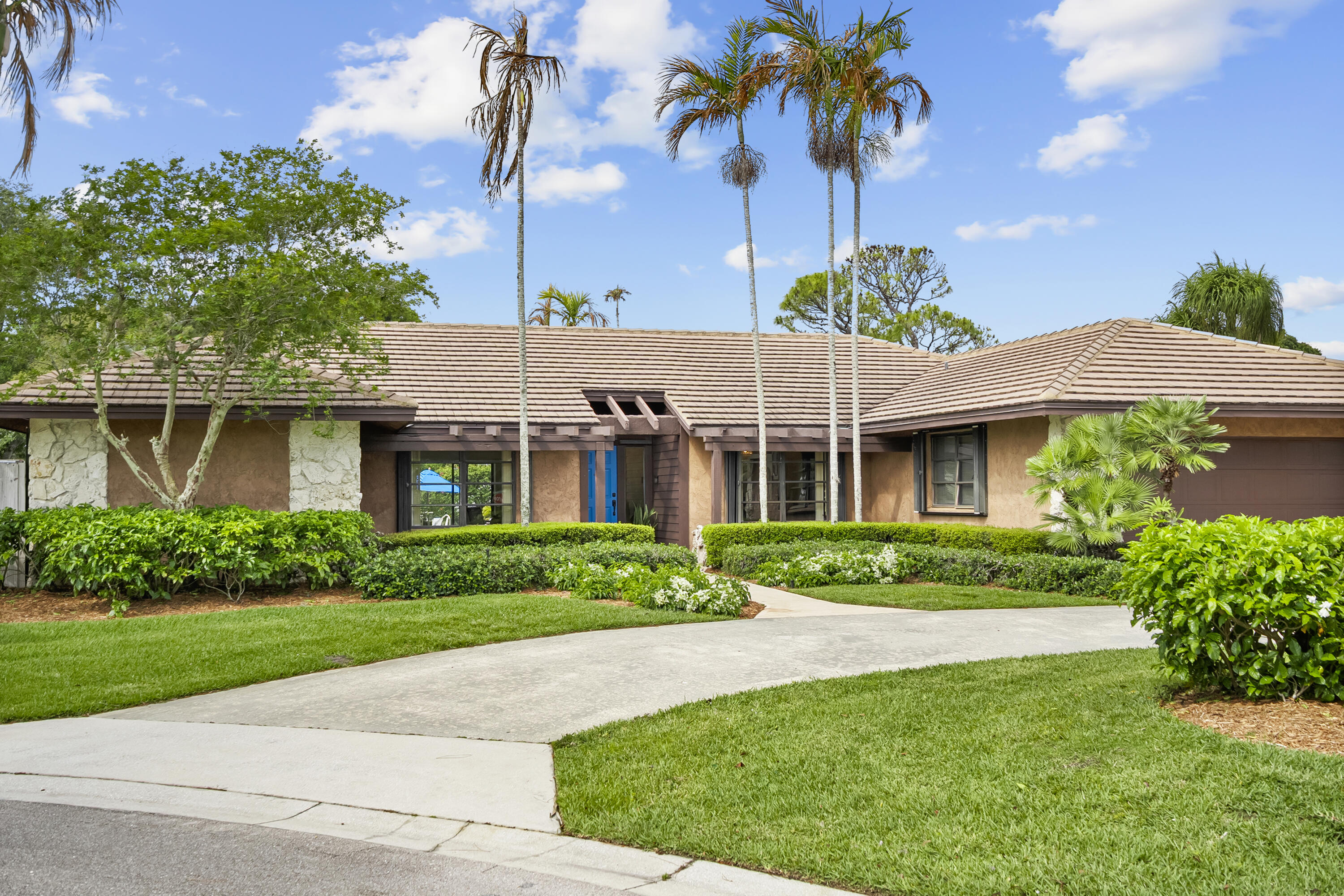 18815 South Golden Hawk Trail Jupiter, FL 33458 - Photo 1 of 49 a view of a house with a garden