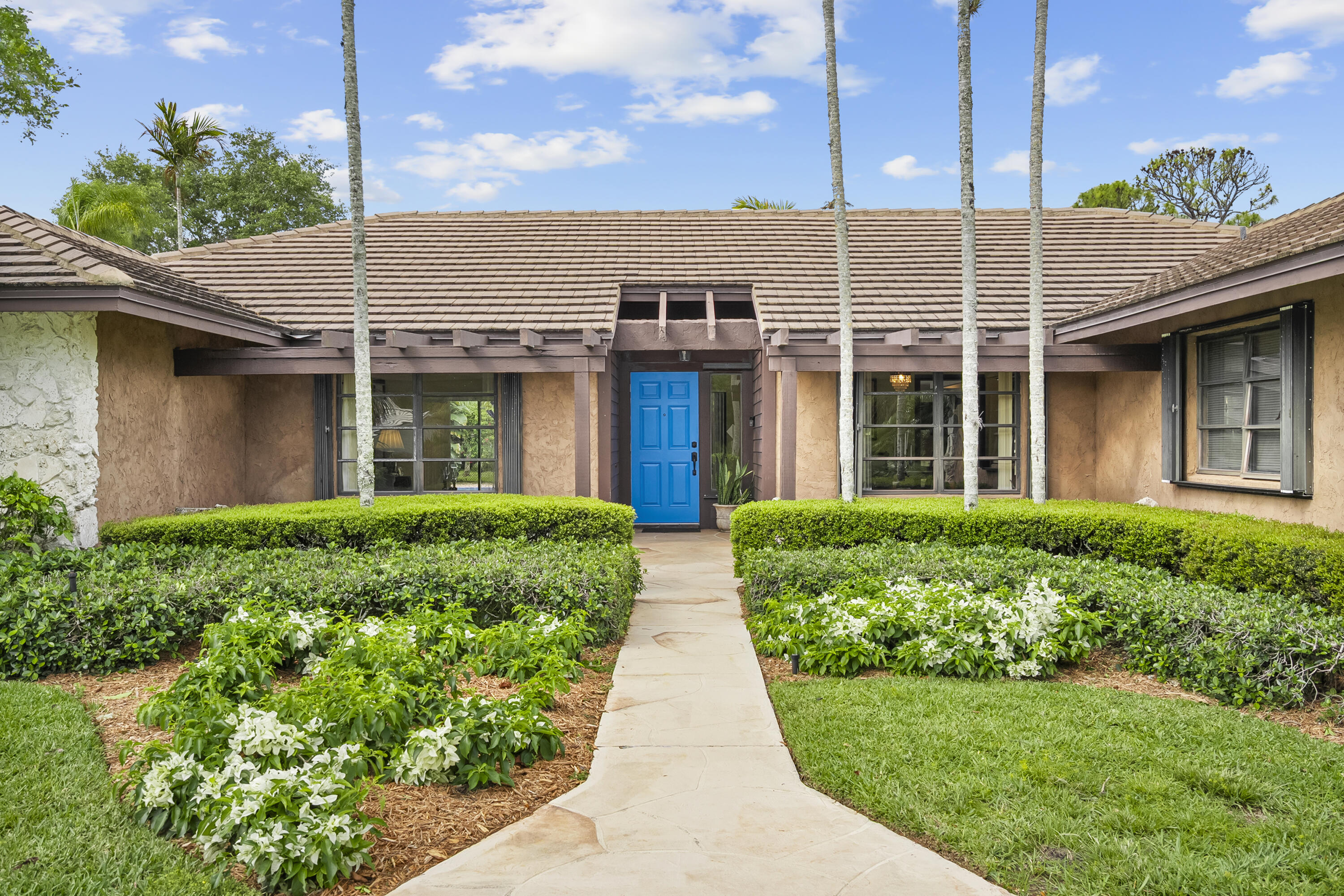 18815 South Golden Hawk Trail Jupiter, FL 33458 - Photo 11 of 49 front view of a house with a yard