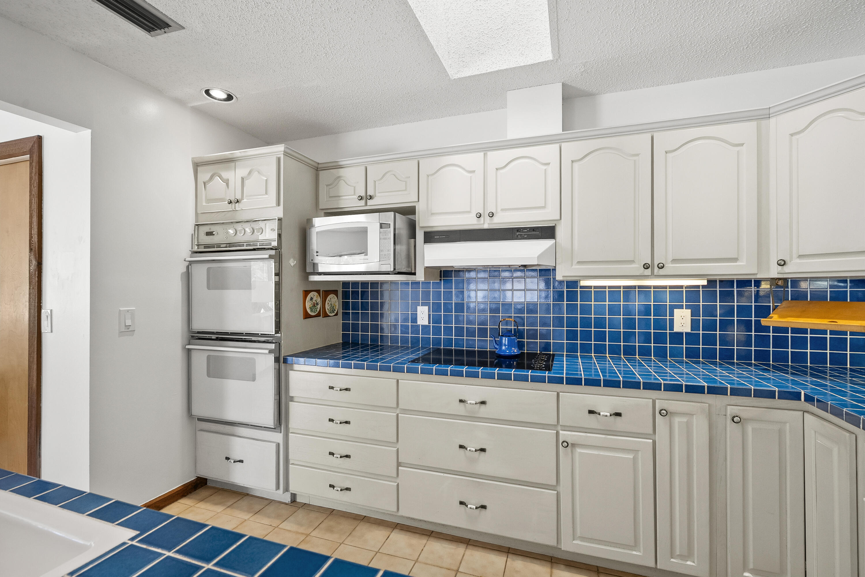 18815 South Golden Hawk Trail Jupiter, FL 33458 - Photo 22 of 49 a kitchen with stainless steel appliances a refrigerator sink and cabinets